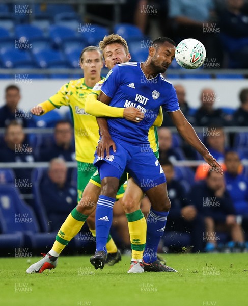 280818 - Cardiff City v Norwich City, Carabao Cup - Loic Damour of Cardiff City and Tom Trybull of Norwich City compete for the ball