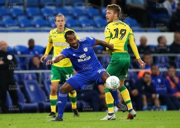 280818 - Cardiff City v Norwich City, Carabao Cup - Loic Damour of Cardiff City and Tom Trybull of Norwich City compete for the ball