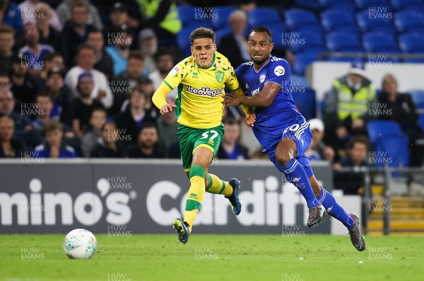 280818 - Cardiff City v Norwich City, Carabao Cup - Loic Damour of Cardiff City and Alexander Tettey of Norwich City compete for the ball