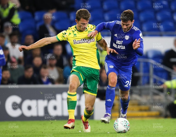 280818 - Cardiff City v Norwich City, Carabao Cup - Gary Madine of Cardiff City is challenged by Christoph Zimmermann of Norwich City