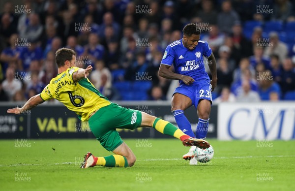 280818 - Cardiff City v Norwich City, Carabao Cup - Kadeem Harris of Cardiff City is tackled by Christoph Zimmermann of Norwich City as he shoots at goal