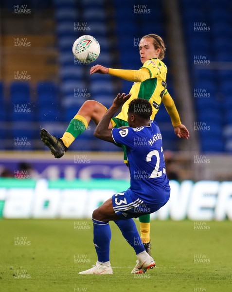 280818 - Cardiff City v Norwich City, Carabao Cup - Todd Cantwell of Norwich City plays the ball over Kadeem Harris of Cardiff City
