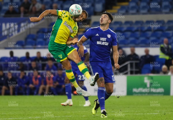 280818 - Cardiff City v Norwich City, Carabao Cup - Moritz Leitner of Norwich City gets to the ball as Callum Paterson of Cardiff City closes in