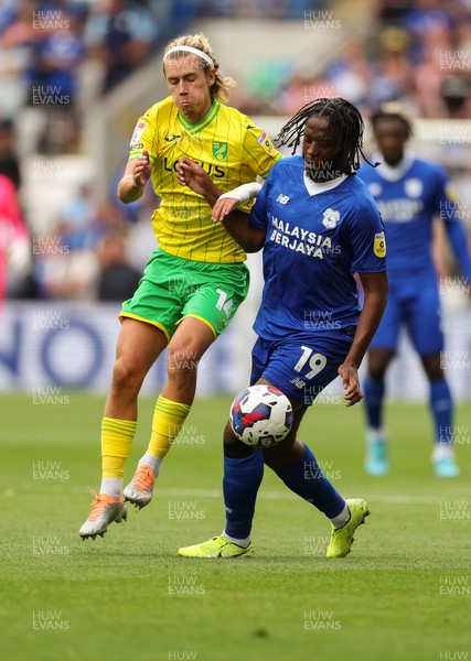 300722 - Cardiff City v Norwich City, Sky Bet Championship - Romaine Sawyers of Cardiff City and Todd Cantwell of Norwich City compete for the ball