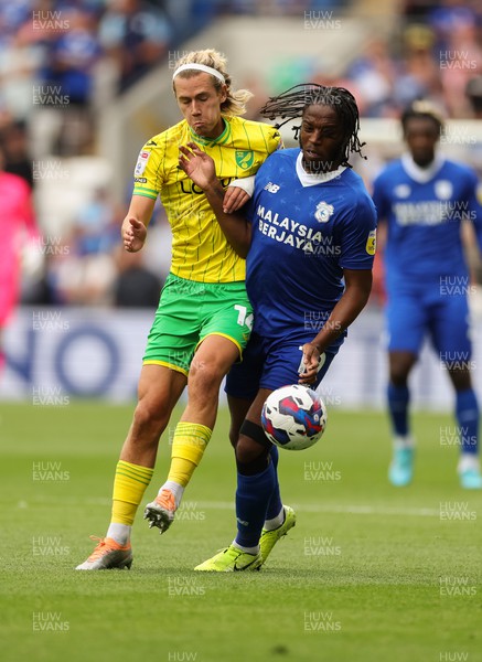 300722 - Cardiff City v Norwich City, Sky Bet Championship - Romaine Sawyers of Cardiff City and Todd Cantwell of Norwich City compete for the ball