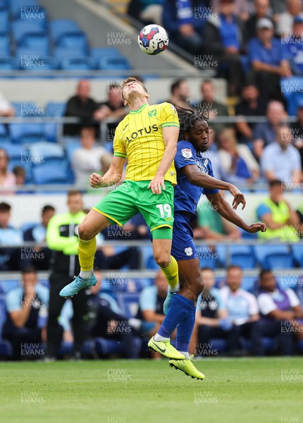 300722 - Cardiff City v Norwich City, Sky Bet Championship - Jacob Sorensen of Norwich City and Romaine Sawyers of Cardiff City compete for the ball
