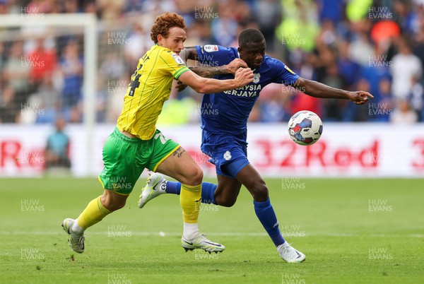 300722 - Cardiff City v Norwich City, Sky Bet Championship - Jamilu Collins of Cardiff City is challenged by Josh Sargent of Norwich City