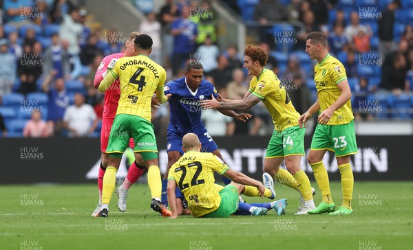 300722 - Cardiff City v Norwich City, Sky Bet Championship - Andy Rinomhota of Cardiff City pushes Teemu Pukki of Norwich City off Perry Ng of Cardiff City as tempers flare in the second half