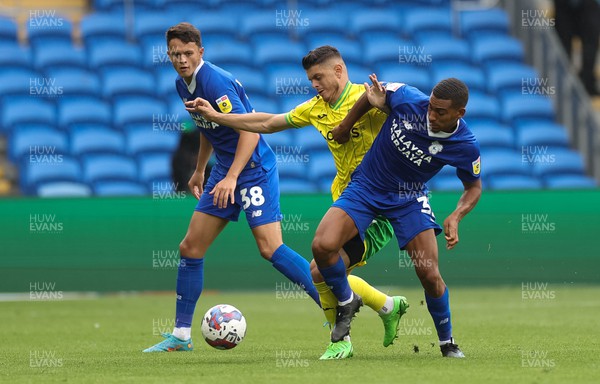 300722 - Cardiff City v Norwich City, Sky Bet Championship - Milot Rashica of Norwich City is tackled by Andy Rinomhota of Cardiff City