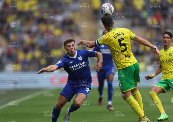 300722 - Cardiff City v Norwich City, Sky Bet Championship - Mark Harris of Cardiff City closes in on Grant Hanley of Norwich City