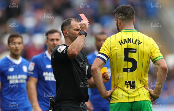 300722 - Cardiff City v Norwich City, Sky Bet Championship - Grant Hanley of Norwich City is shown a red card after a second yellow