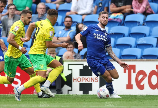 300722 - Cardiff City v Norwich City, Sky Bet Championship - Joe Ralls of Cardiff City takes on Max Aarons of Norwich City