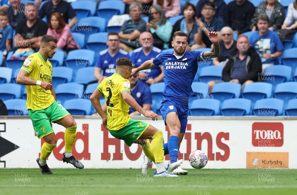 300722 - Cardiff City v Norwich City, Sky Bet Championship - Joe Ralls of Cardiff City takes on Max Aarons of Norwich City