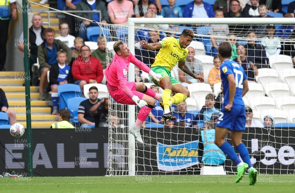 300722 - Cardiff City v Norwich City, Sky Bet Championship - Cardiff City goalkeeper Ryan Allsop collides with Onel Hernandez of Norwich City
