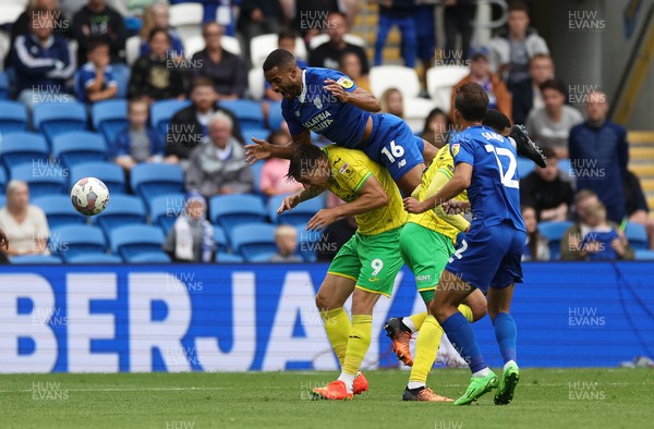 300722 - Cardiff City v Norwich City, Sky Bet Championship - Curtis Nelson of Cardiff City gets above Jordan Hugill of Norwich City