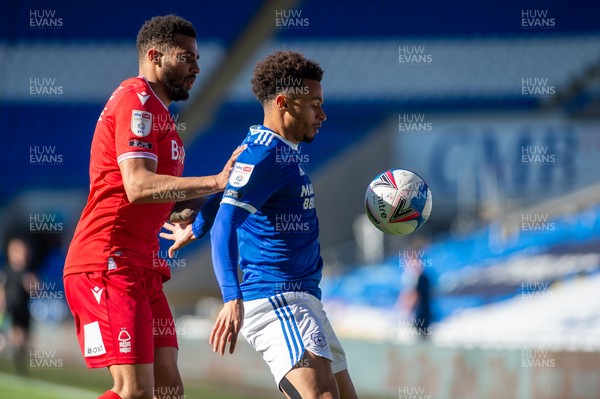 020421 - Cardiff City v Nottingham Forest - Sky Bet Championship - Josh Murphy of Cardiff City holds off Cyrus Christie of Nottingham Forest