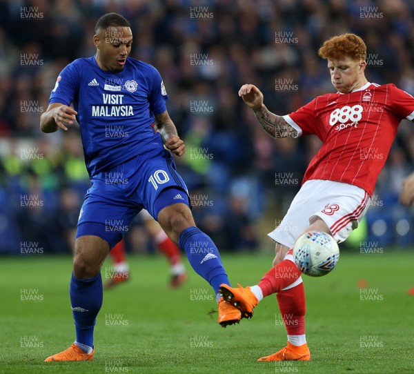 210418 - Cardiff City v Nottingham Forest - SkyBet Championship - Kenneth Zohore of Cardiff City is challenged by Jack Colback of Nottingham Forest