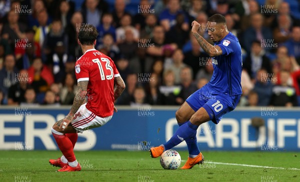 210418 - Cardiff City v Nottingham Forest - SkyBet Championship - Kenneth Zohore of Cardiff City gets past Danny Fox of Nottingham Forest
