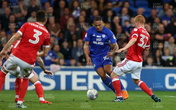 210418 - Cardiff City v Nottingham Forest - SkyBet Championship - Kenneth Zohore of Cardiff City is challenged by Ben Watson of Nottingham Forest