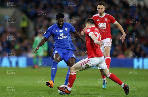 210418 - Cardiff City v Nottingham Forest - SkyBet Championship - Bruno Ecuele Manga of Cardiff City is tackled by Joe Lolley of Nottingham Forest