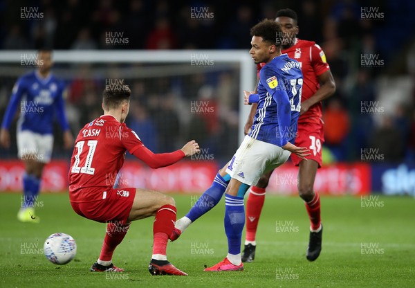 250220 - Cardiff City v Nottingham Forest - SkyBet Championship - Josh Murphy of Cardiff City is challenged by Matty Cash of Nottingham Forest