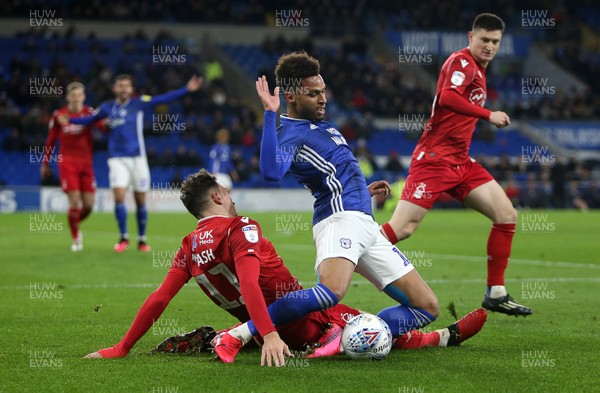 250220 - Cardiff City v Nottingham Forest - SkyBet Championship - Josh Murphy of Cardiff City is tackled by Matty Cash of Nottingham Forest