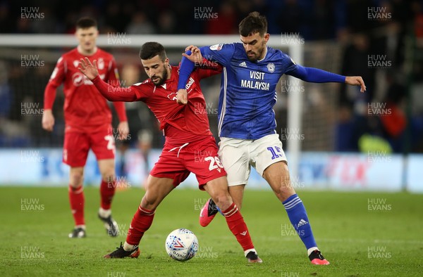 250220 - Cardiff City v Nottingham Forest - SkyBet Championship - Marlon Pack of Cardiff City is challenged by Tiago Silva of Nottingham Forest