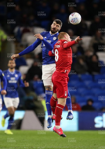 250220 - Cardiff City v Nottingham Forest - SkyBet Championship - Callum Paterson of Cardiff City and Ben Watson of Nottingham Forest go up for the ball