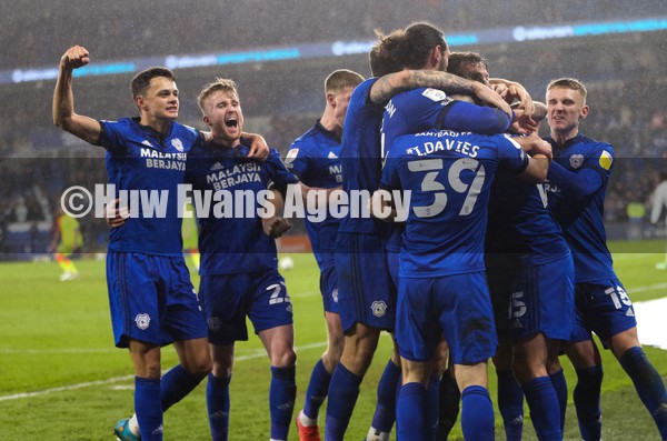 300122 - Cardiff City v Nottingham Forest, Sky Bet Championship - Team mates mob Isaak Davies of Cardiff City as he celebrates after scoring the second goal