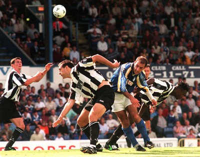 300897 - Cardiff City v Notts County - Notts Graeme Hogg clears from Scott Partridge