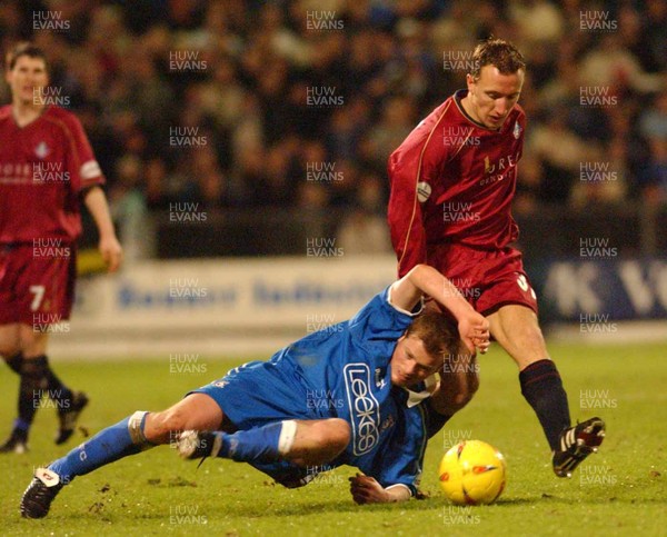 310103 - Cardiff City v Oldham Athletic - Division Two - Cardiff's Alan Mahon goes down while challenging Tony Carss