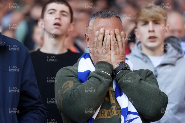 210425 - Cardiff City v Oxford United - SkyBet Championship - Dejected Cardiff City fans at full time
