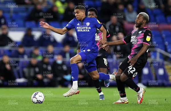 090222 - Cardiff City v Peterborough United - SkyBet Championship - Cody Drameh of Cardiff City is challenged by Jeando Fuchs of Peterborough United