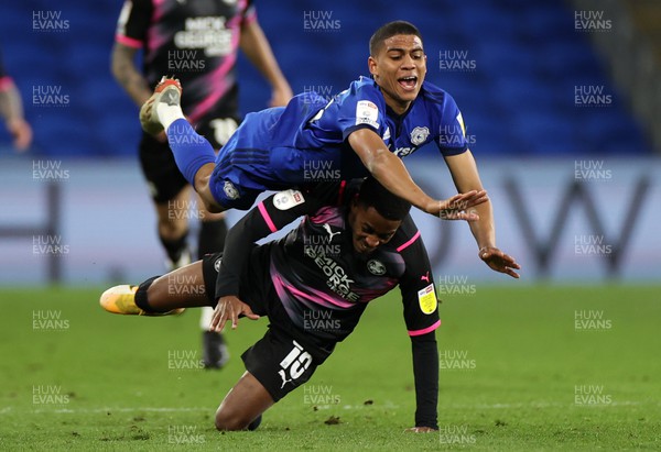090222 - Cardiff City v Peterborough United - SkyBet Championship - Cody Drameh of Cardiff City is tackled by Reece Brown of Peterborough United