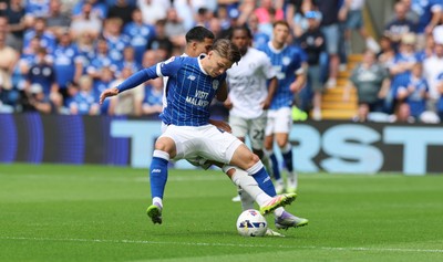 020825 - Cardiff City v Peterborough United, EFL Sky Bet League 1 - Cian Ashford of Cardiff City is challenged by Brandon Khela of Peterborough United