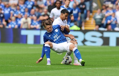 020825 - Cardiff City v Peterborough United, EFL Sky Bet League 1 - Cian Ashford of Cardiff City is challenged by Brandon Khela of Peterborough United