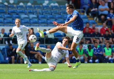020825 - Cardiff City v Peterborough United, EFL Sky Bet League 1 - Rubin Colwill of Cardiff City wins the ball from Oscar Wallin of Peterborough United