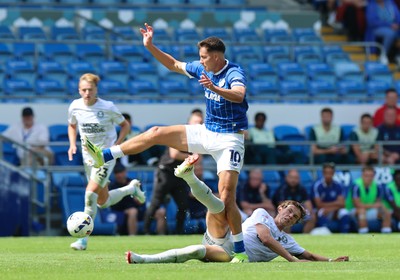 020825 - Cardiff City v Peterborough United, EFL Sky Bet League 1 - Rubin Colwill of Cardiff City wins the ball from Oscar Wallin of Peterborough United