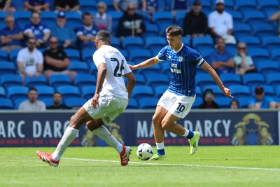 020825 - Cardiff City v Peterborough United, EFL Sky Bet League 1 - Rubin Colwill of Cardiff City takes on David Okagbue of Peterborough United