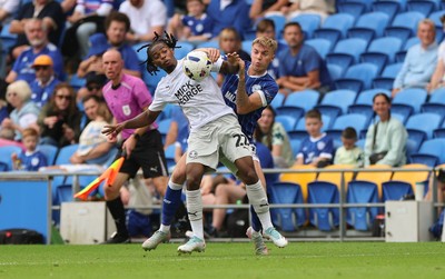 020825 - Cardiff City v Peterborough United, EFL Sky Bet League 1 - Donay O'Brien-Brady of Peterborough United and Joel Bagan of Cardiff City compete for the ball