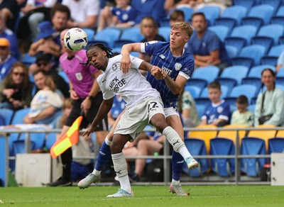 020825 - Cardiff City v Peterborough United, EFL Sky Bet League 1 - Donay O'Brien-Brady of Peterborough United and Joel Bagan of Cardiff City compete for the ball