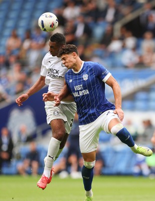 020825 - Cardiff City v Peterborough United, EFL Sky Bet League 1 - Yousef Salech of Cardiff City and David Okagbue of Peterborough United compete for the ball