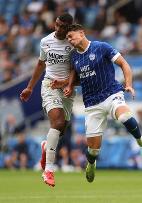 020825 - Cardiff City v Peterborough United, EFL Sky Bet League 1 - Yousef Salech of Cardiff City and David Okagbue of Peterborough United compete for the ball