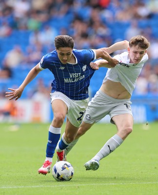 020825 - Cardiff City v Peterborough United, EFL Sky Bet League 1 - Joel Colwill of Cardiff City and George Nevett of Peterborough United compete for the ball