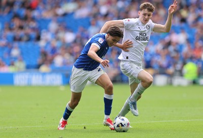 020825 - Cardiff City v Peterborough United, EFL Sky Bet League 1 - Joel Colwill of Cardiff City and George Nevett of Peterborough United compete for the ball