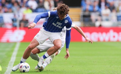 020825 - Cardiff City v Peterborough United, EFL Sky Bet League 1 - Ollie Tanner of Cardiff City is tackled by Harley Mills of Peterborough United