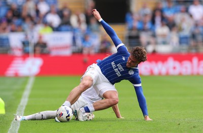 020825 - Cardiff City v Peterborough United, EFL Sky Bet League 1 - Ollie Tanner of Cardiff City is tackled by Harley Mills of Peterborough United