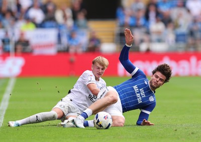 020825 - Cardiff City v Peterborough United, EFL Sky Bet League 1 - Ollie Tanner of Cardiff City is tackled by Harley Mills of Peterborough United
