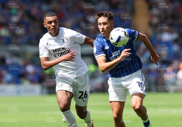 020825 - Cardiff City v Peterborough United, EFL Sky Bet League 1 - Rubin Colwill of Cardiff City and David Okagbue of Peterborough United compete for the ball