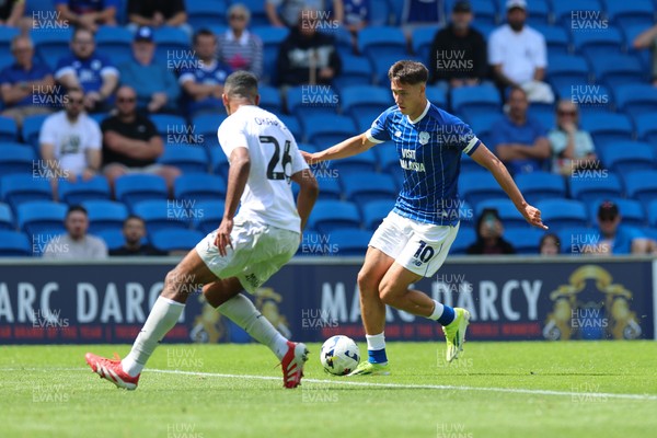 020825 - Cardiff City v Peterborough United, EFL Sky Bet League 1 - Rubin Colwill of Cardiff City takes on David Okagbue of Peterborough United